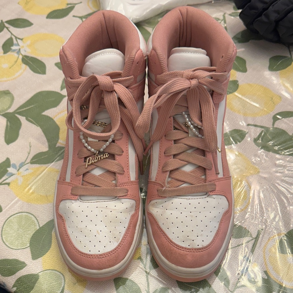 Puma Pink and White High-Top Sneakers with Gold Charm